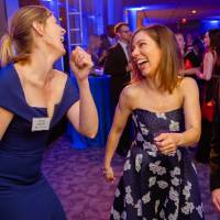 Two guests dancing in the Laker Lounge